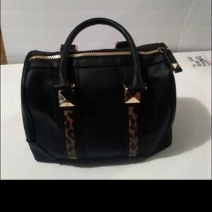 Victoria's Secret, with black faux leather and cheetah print purse